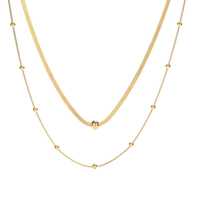 Gold-plated necklace with a delicate cubic zirconia pendant on a white background.