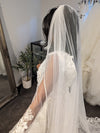 Close-up of the ALLIE veil’s beaded edge, extending from the comb to the lace detailing.