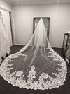 Detailed shot of the handcrafted lacework on the OLGA veil's edge.