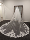 "Close-up of the INEZ veil's intricate 3D floral elements handcrafted on soft tulle."