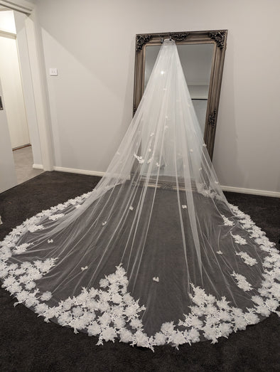 "Side profile of the INEZ wedding veil highlighting the elegant Venice lace and floral appliqués."