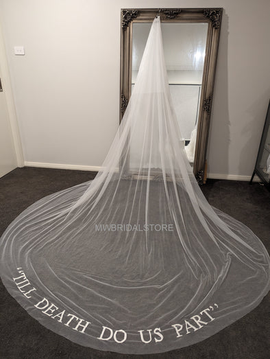 Wedding veil with 'Till death do us part' embroidery, symbolizing eternal commitment