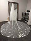 Close-up of the SAMANTHA drop-style veil showcasing intricate 3D flower designs with pearl accents on delicate tulle.