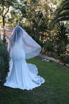 Image of a pearl wedding veil with delicate pearl accents