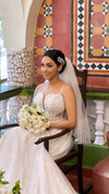 Silver bridal tiara with rhinestone detailing.