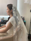 Image of a pearl wedding veil with delicate pearl accents and 3D florals