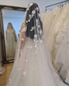 Image of a pearl wedding veil with delicate pearl accents and 3D florals