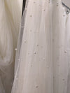 Image of a pearl wedding veil with delicate pearl accents