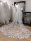 Delicate bridal veil with lightweight tulle and hand-sewn 3D lace flowers for a whimsical touch