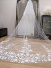 Close-up of the SUZIE veil's intricate 3D floral lace detailing on soft ivory tulle.