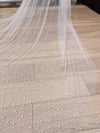 Image of a pearl wedding veil with delicate pearl accents
