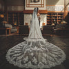 Close-up of REANNA Handmade Lace Mantilla Veil with intricate floral lace trim